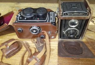 A Rolleicord and a Voigtlander medium format cameras.