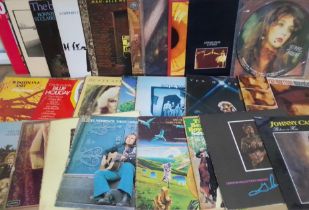 A box of vinyl LP records including Kate Bush, Van Morrison, Jethro Tull, Ralph McTell, Johnny Cash,