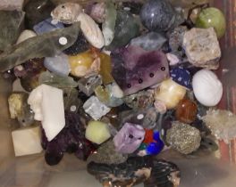 A box of assorted crystals, polycrystalline and fashioned minerals.