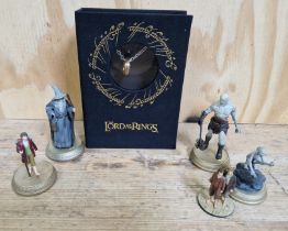 A Lord of the Rings ring on chain together with a group of 5 Lord of the Rings figures comprising