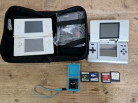 Two Nintendo DS portable games consoles with a few games and case.