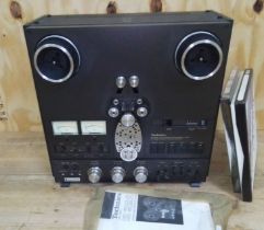 A Technics RS-1506 reel to reel 4 track tape deck.