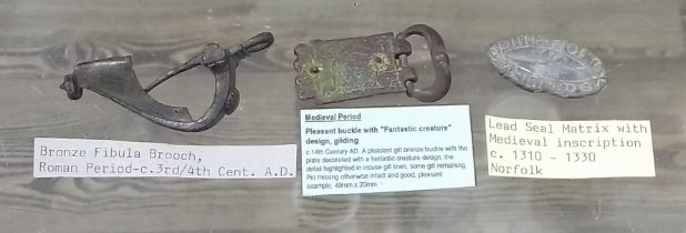 Assorted metal detector finds comprising a Roman bronze fibular brooch, a medieval gilt bronze
