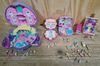 A collection of Polly Pocket toys including figures.