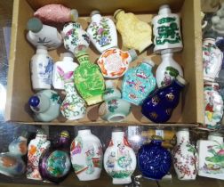 A collection of approx. 26 Chinese snuff bottles, mainly porcelain, also including cinnabar