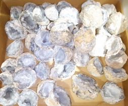 A box of assorted crystal geodes.