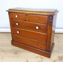 A Victorian mahogany 'apprentice' chest of drawers, height 35.5cm.