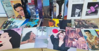A box of approximately 41 LP vinyl records including 7 Elvis, 3 Rod Stewart, Four Topps, Yes, Dianna