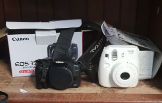 A Sony EOS 350 D camera body, a Fuji Instax mini * camera, and a Velbon tripod