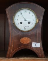 A inlaid oak French bracket clock with pendulum and key.