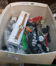 A box of mixed ladies and gents wristwatches.