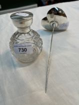 A hallmarked silver desk spike and a glass and hallmarked silver scent bottle.