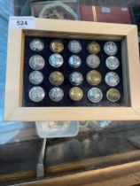 A display case of 20 mainly British municipal transport buttons, some possible police.