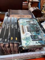 A box of Boxed Warhammer Champions card game, mainly unopened, all boxed.