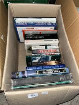 A box of books relating to WWII and the Battle of the Atlantic.
