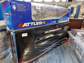 A boxed R/C stinger boat & a Boxed R/C HT-3827 Battleship 1/360 Scale.