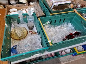 Two green crates of glassware