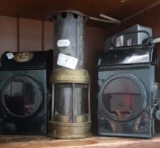 2 vintage lanterns, possibly railway related, one marked GR 11-1940 SNLW Ltd, together with a miners