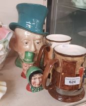 Five pieces of Beswick comprising 1970s limited edition Scrooge tankards, salt and pepper pots &