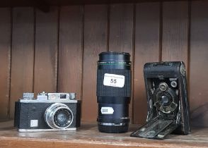 A Halina 35x camera with 45mm Halina Anastigmat lens, a Kodak Diomatic No 0 pocket camera, and a