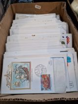 A box of world stamp covers.