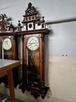 A Gustav Becker Vienna wall clock complete with weights, pendulum and key.