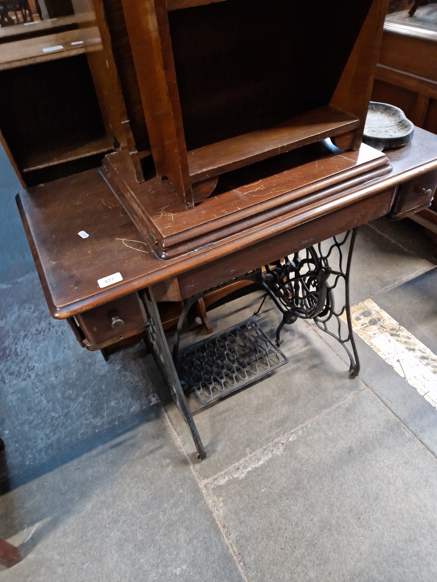 A Singer treadle sewing machine.