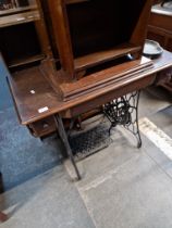 A Singer treadle sewing machine.