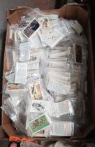 A box of assorted cigarette cards.