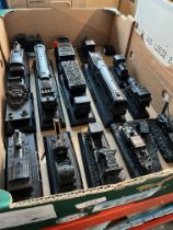 A box of assorted train models made from coal