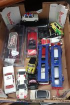 A box of Corgi diecast model vehicles including car transporters, limited edition Original Omnibus