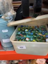 Two tubs of glass marbles.