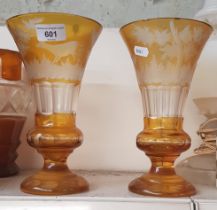 Pair of late 19th century Bohemian amber glass vases etched with deer in a landscape