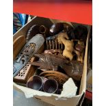 A box of treen including carved wood animals, African items, etc.