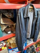 A vintage leather Royal Navy Sea Harrier flying jacket and a pair of size 10 pilot's flying boots.