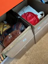 Two boxes of ladies handbags and a box of boxed ladies shoes