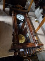 A Gustav Becker Vienna wall clock complete with weights, pendulum and key.