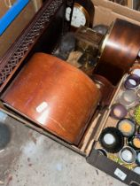 A box containing clocks, post office scales, treen, ethnic carving etc