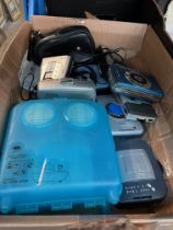 A box of vintage cassette players, minidisc player and a waterproof speaker system