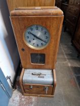 An early 20th century oak cased 'Synchromatic Time System' clocking in clock.