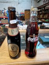 A 1959 full bottle of Guinness 200th Anniversary issue (sealed), and a 1974 FIFA World Cup....