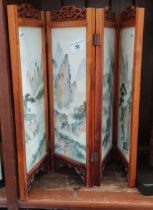 A Chinese table top folding screen with hand painted white marble panels.