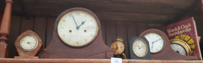 An Enfield mantle clock, 3 small mantle clocks, a barometer, and a book on clocks