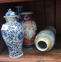 Four Eastern vases, including prunus (with chip to rim); a Japanese Imari vase; blue and white