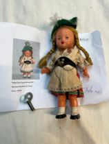 A vintage German wind up Polka dancing doll, circa 1950s.