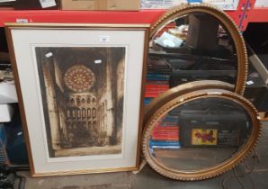 An oval gilt framed mirror and a signed print after Frank Harding depicting the Rose Window