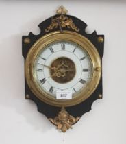 A French wall clock with pendulum and key, circa 1860s.