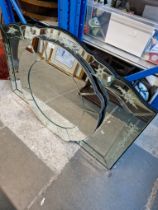 An etched glass overmantle mirror together with another modern wall mirror.