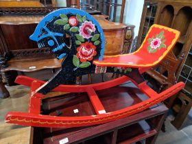 A Russian hand painted rocking horse.