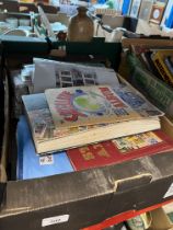 A box of assorted stamps and stamp albums